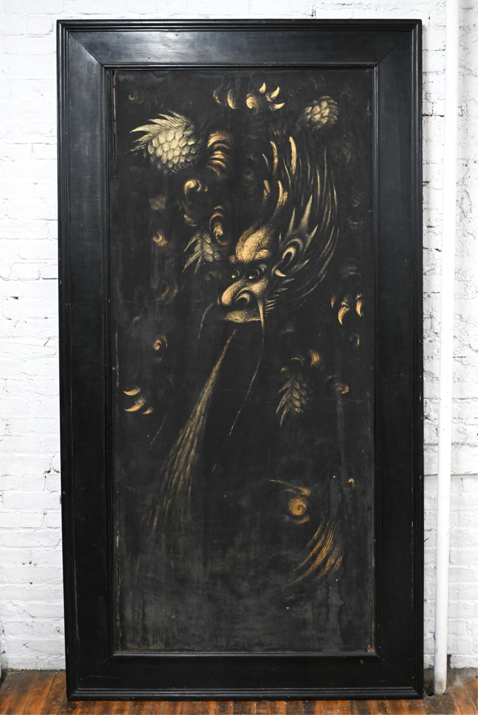Appears to be a salvaged door. Depiction of a dragon in gold dust pigment on wood panel, with (1 of 11)