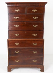 Cherrywood with brass pulls and locks. Chest sits freely on chest base. Late 18th or early 19th