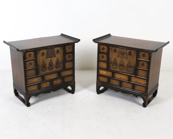 Calligraphy to backs. Brass hardware. Drop down slat center panels with apothecary drawers.