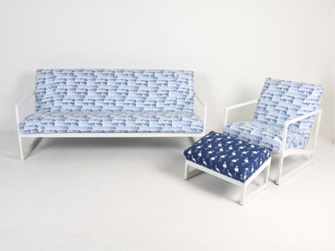 In the manner of Llyod Flanders. Contemporary. (1) Chair, sofa and ottoman. Ottoman with different