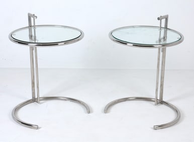 PAIR OF ADJUSTABLE CHROME AND GLASS SIDE TABLES