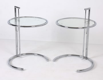 PAIR OF ADJUSTABLE CHROME AND GLASS SIDE TABLES