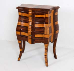 Patchwork style walnut and rosewood veneer with brass drawer pulls. Dimensions: H 32" x W 23" x D