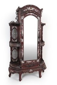 Mahogany armoire cabinet with extensive mother-of-pearl inlaid decoration throughout. Early 1900s.