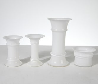 (4) glass vases. Tags on sides. Dimensions: Tallest H 9" x Dia. 4.5". Condition: Few rubs on edges.