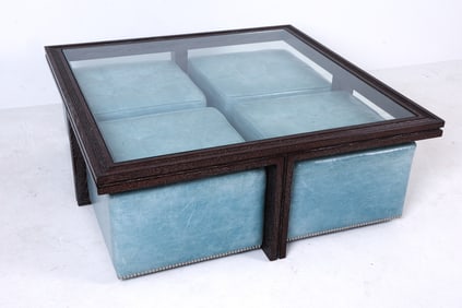 Oak frame in dark tone with glass top. Leather upholstered ottomans on casters. Dimensions: H 16" x