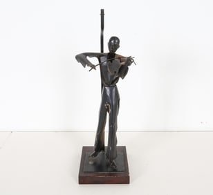 Shaped steel in the guise of a fiddle player. Set on wooden base. Apparently unsigned. Dimensions: H