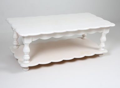 Two-tiered scalloped edge coffee table in white painted finish. 20th century. Dimensions: H 17.5" x