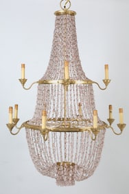 Three-tiered chandelier with gold toned metal and pink beaded design. Contemporary. Dimensions: H