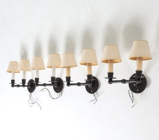 Grouping of (4) double-light wall sconces with candle form. Dimensions: H 10" x W 11" x D 8.5".