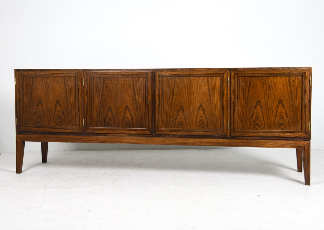 SEVERIN HANSEN ROSEWOOD SIDEBOARD C. 1970S: Key included. Rosewood sideboard with adjustable shelves. Apparently unmarked. Denmark, circa 1970s. Dimensions: H 31" x W 83" x D 18.5". Condition: Minor scuffs and scratches, few rubs to corners. We