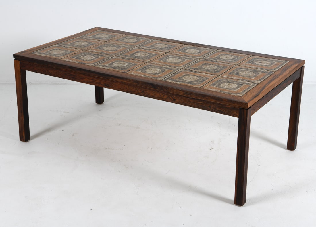 STYLE OF HASLEV ROSEWOOD & TILE COFFEE TABLE 1960S: Rosewood coffee table with ceramic tiles inlaid to top. Denmark, circa 1960s. Dimensions: H 20.25" x W 52.75" x D 29". Condition: Minor scuffs to wood and tiles. Wear consistent with age and use. Clev