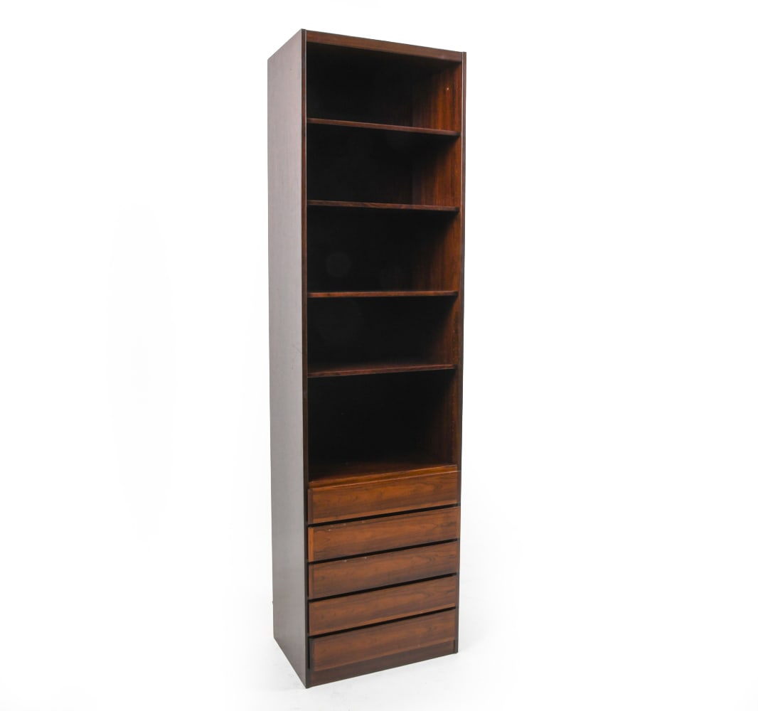 OMANN JUN SCAN-FLEX DANISH ROSEWOOD BOOKCASE 1960S: Tall rosewood bookcase cabinet. Adjustable shelves. Tagged to back. Denmark, circa 1960s. Dimensions: H 84" x W 23.25" x D 16.25". Condition: Minor scuffs. Wear consistent with age and use. PERG065
