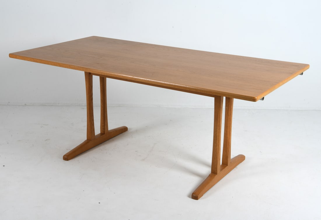 BORGE MOGENSEN "SHAKER" OAK DINING TABLE C. 1970S: (2) Leaves included. For Vitze Mobler. Tagged underneath. Denmark, circa 1970s. Dimensions: H 29.5" x W 71" x D 35.5". Leaves W 18.5". Condition: Minor scuffs and scratches, presents well overall. CLE