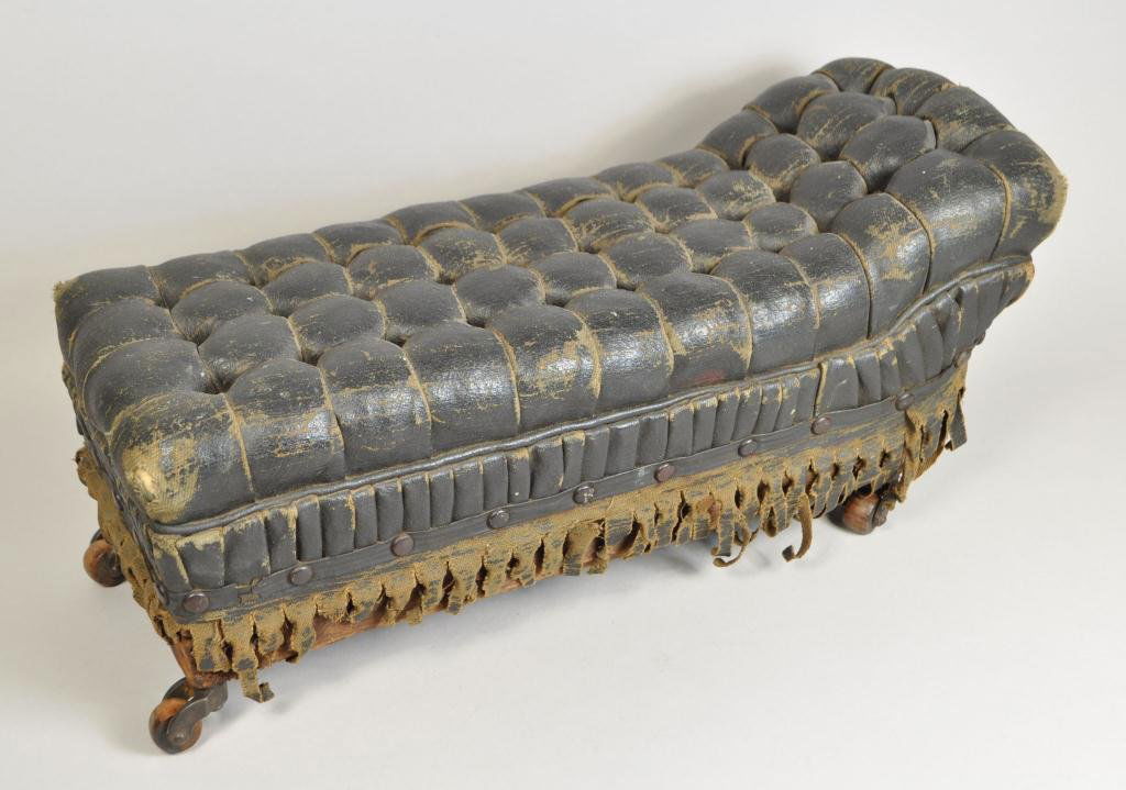 19TH C. SALESMAN SAMPLE LEATHER CHAISE LOUNGE: Dimensions: H 8.5" x W 7.5" x L 18.5" Condition: Good, some ware very dry to the black leather.