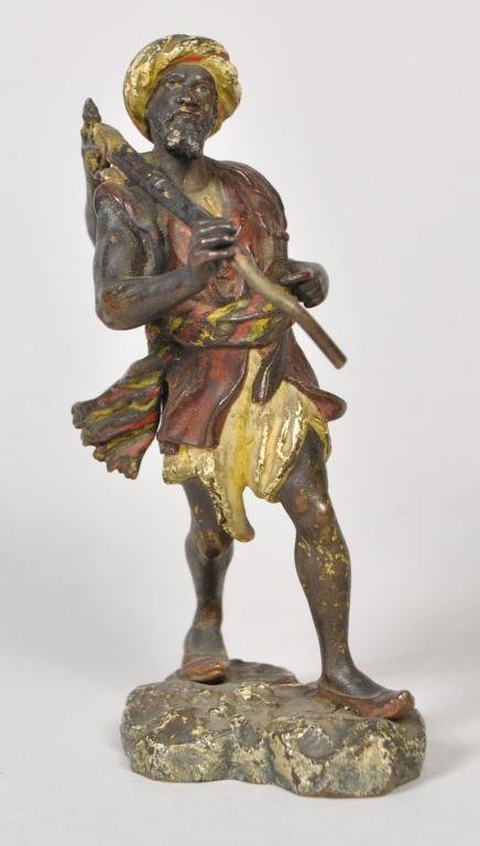 FRANZ XAVER BERGMAN (VIENNA 1861-1936): Cold-painted bronze figure of a man walking with a rifle & holding his sword, ca 1900, stamped both on the lower back & bottom of the base B within an urn, GESCHUTZT numbered 3412. Dimension: H 5" x W