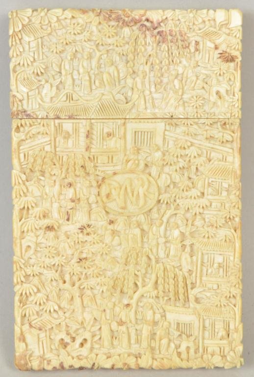 LATE 19th C CHINESE CARVED IVORY CARD CASE: Chinese ivory card case; intricately carved with scenes of everyday life and initials inscribed DWR inside the oval. Measures 4 ½” x 3" x ¼”. Note: The elephant ivory used in this lot was legall