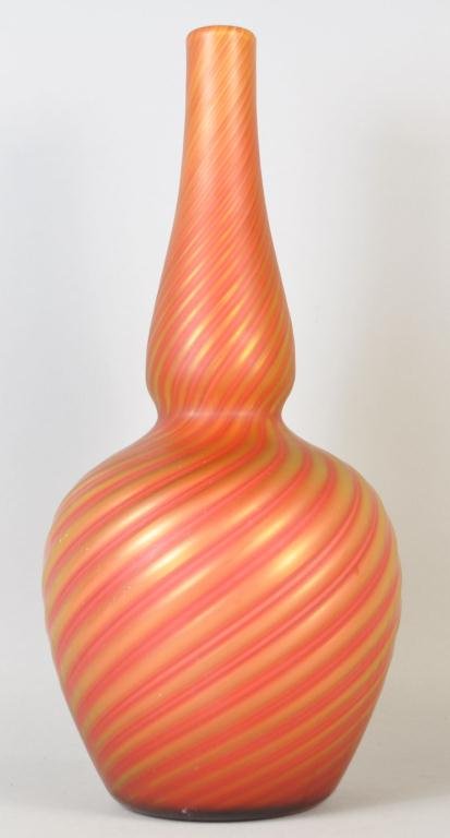 SATIN ART GLASS VASE STEVENS AND WILLIAMS: Hand blown orange, red, yellow satin iridescent art glass. Measures H13 ½” x W 6 ½”x Dia.1 ½” Provenance: Arthur and Joe Robinson Collection, Harrison, New York