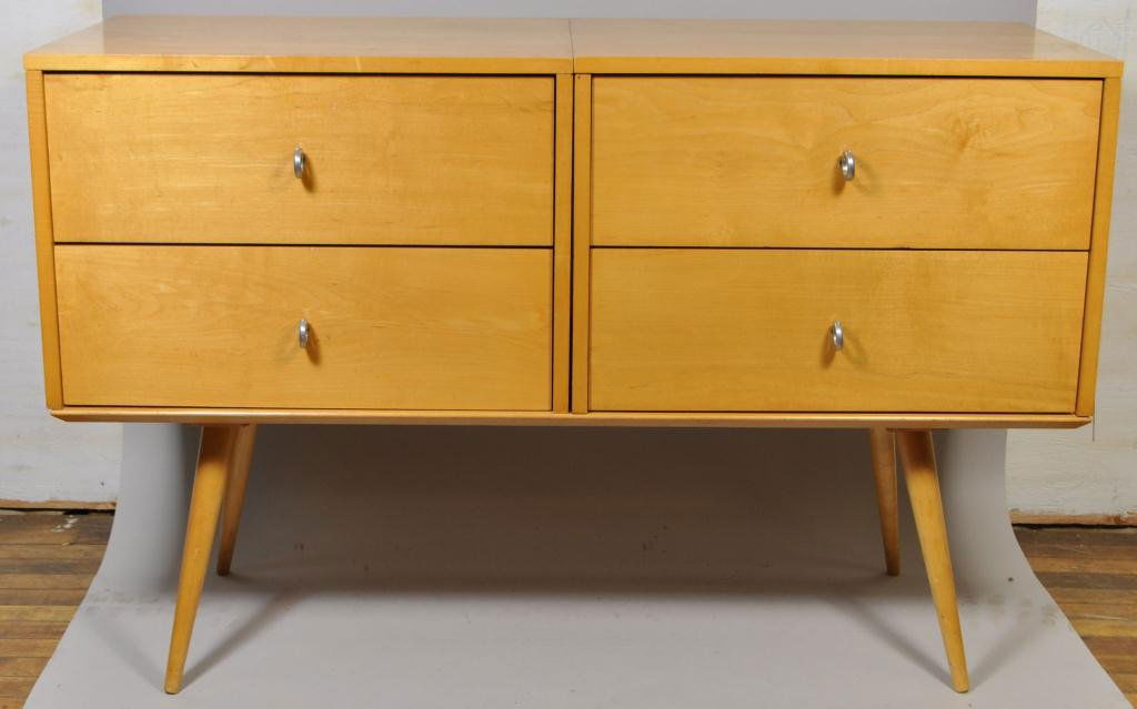 PAUL MCCOBB PLANNER GROUP FOUR DRAWER CHEST: Dimension: H 31" x W 48" x D 18" Condition: Bottom left side drawer has a small indention to the wood.Scratches,scuff marks.