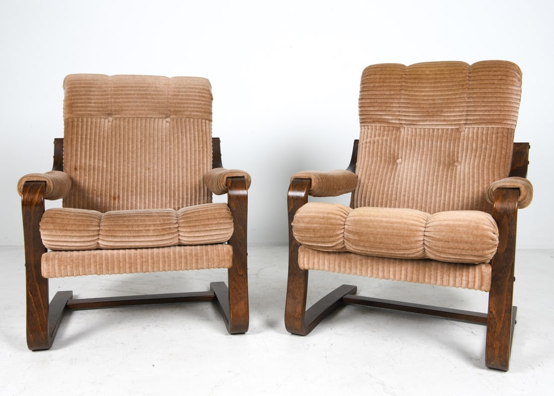 PAIR DANISH BEECH CANTILEVER LOUNGE CHAIRS 1970S: Beech cantilever frames with beige corduroy fabric. Denmark, circa 1970s. Dimensions: H 33" x W 28" x D 28" x SH 17". Condition: Few faint discolored spots to fabric. Slight tobacco odor. Wear consist