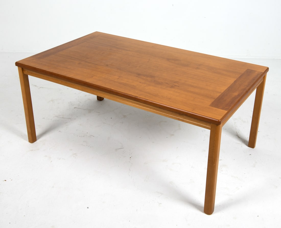 CHRISTIAN HVIDT STYLE DANISH TEAK COFFEE TABLE: Teak rectangular tabletop with slightly darker border detail on the ends. Denmark, circa 1970s. Dimensions: H 21.25" x W 50" x D 29" Condition: Wear consistent with age and use, including rubs and scu