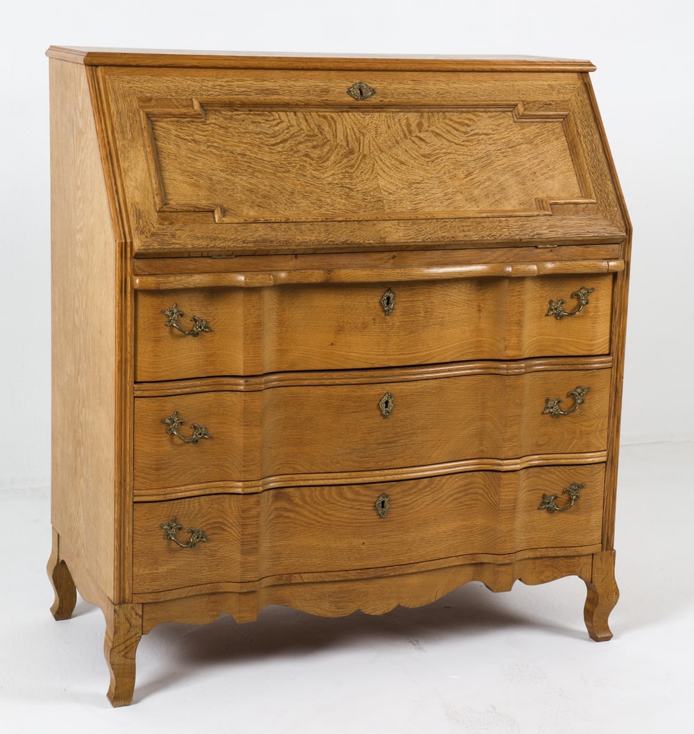 HENNING KJAERNULF STYLE OAK SECRETARY DESK 1970S: Secretary desk in Henning Kjaernulf style, featuring a drop down desk with small drawer at top and drawers below. Includes key. Denmark, circa 1970s. Dimensions: H 42.25" x W 37.25" x D 19" Conditions