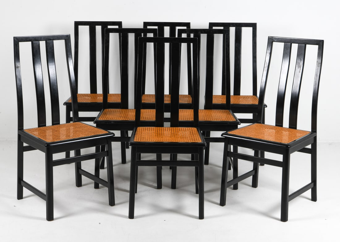 (8) MANNER OF MOTINA BEECH & CANE DINING CHAIRS: Beech frames in black lacquered finish with caning to seats. Scandinavian, circa 1970s. Dimensions: H 40" x W 17.5" x D 18" x SH 18.25". Condition: Minor scuffs and scratches. Few small breaks to cani
