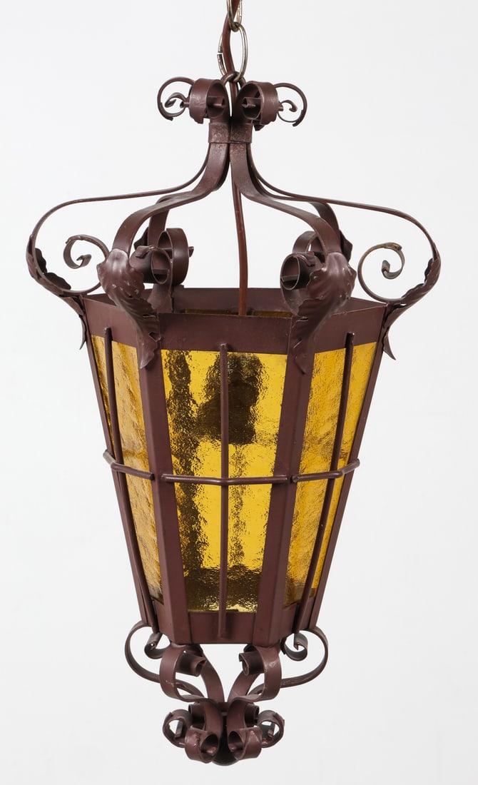 PORTUGUESE STYLE WROUGHT IRON & GLASS LANTERN: Wrought iron lantern with amber glass panels. Denmark, circa 1960s. Dimensions: H 17.75" x DIA. 10.25" Condition: Wiring untested. Wear consistent with age and use. E290