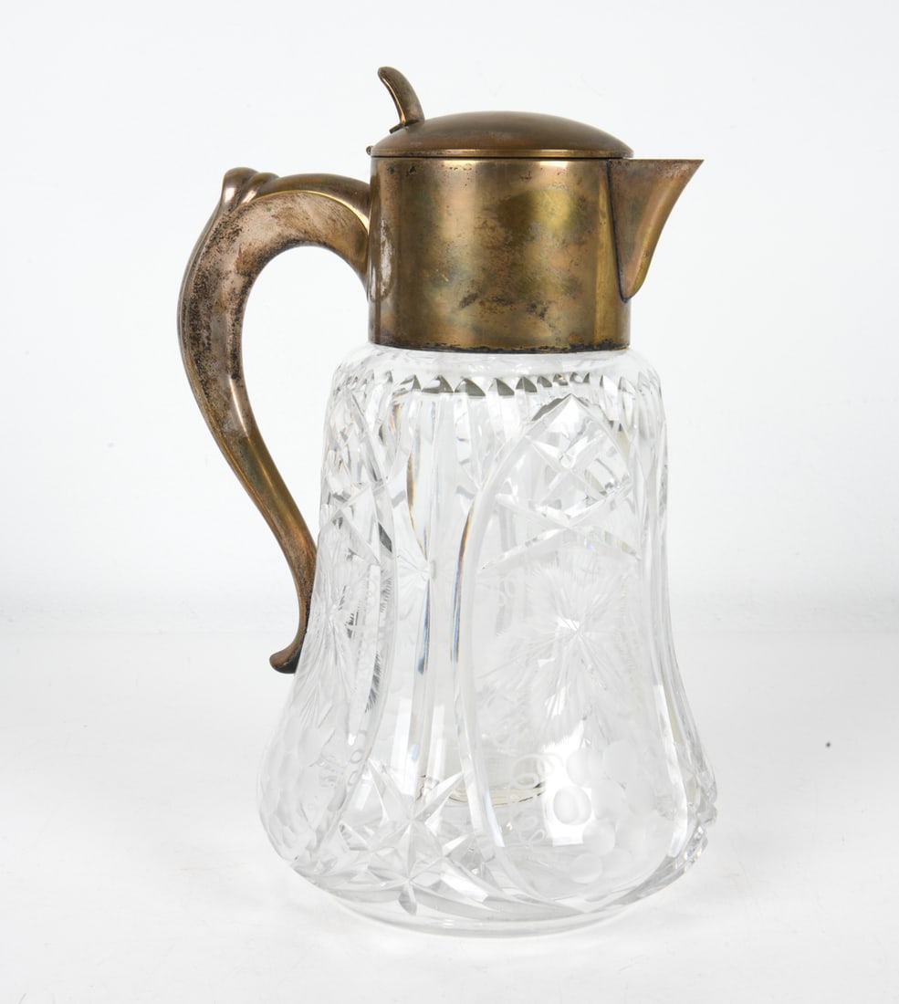VINTAGE GERMAN GLASS PITCHER 20TH C.: Cut crystal glass pitcher. Interior with removable glass tube, meant for ice. Germany, 20th century. Dimensions: H 13.25" x W 7" x D 8.5" Condition: Patina and surface marks to metal, glass with no is