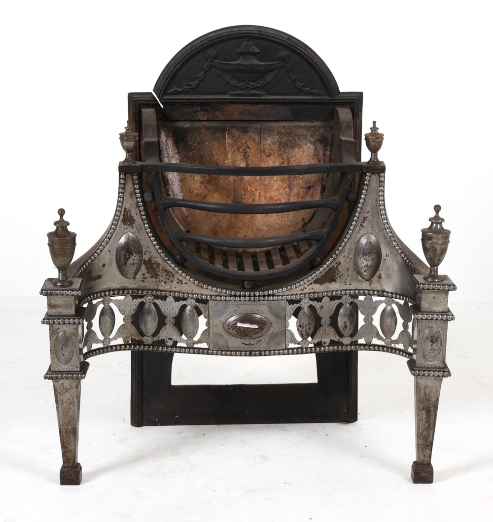 ANTIQUE GEORGIAN SILVERPLATED FIREPLACE GRATE: Early 20th century. Dimensions: H 32" x W 28.5" x D 16.5". Condition: Soot, scuffs, and rubs. Crack to back plate. Wear consistent with age and use.