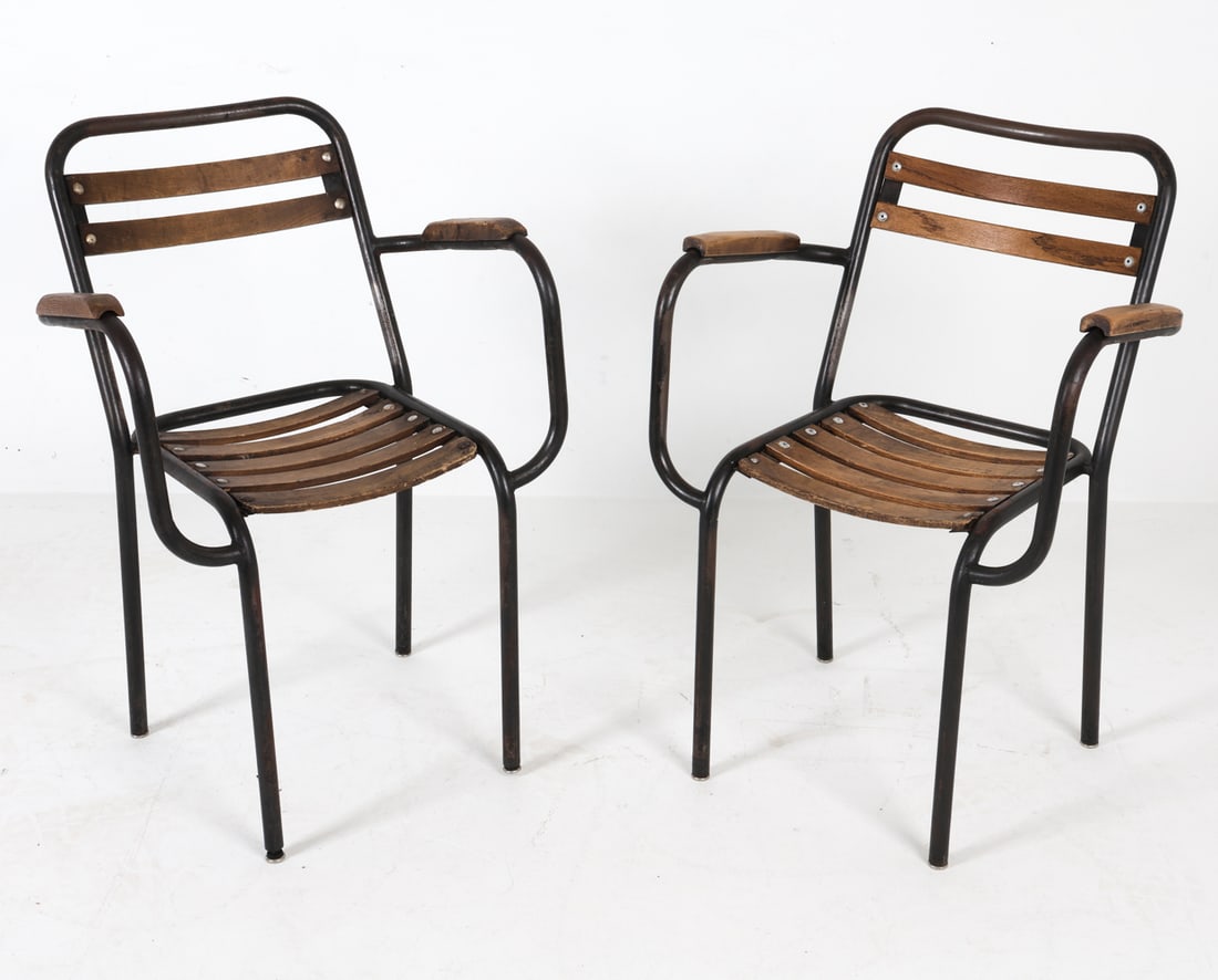 MANNER OF XAVIER PAUCHARD STEEL & OAK ARMCHAIRS: Industrial style steel frames with oak seat, back, and arms in the manner of Xavier Pauchard. Dimensions: H 31.5" x W 21.5" x D 16" x SH 17.5". Condition: Scuffs and scratches to wood and metal, few s