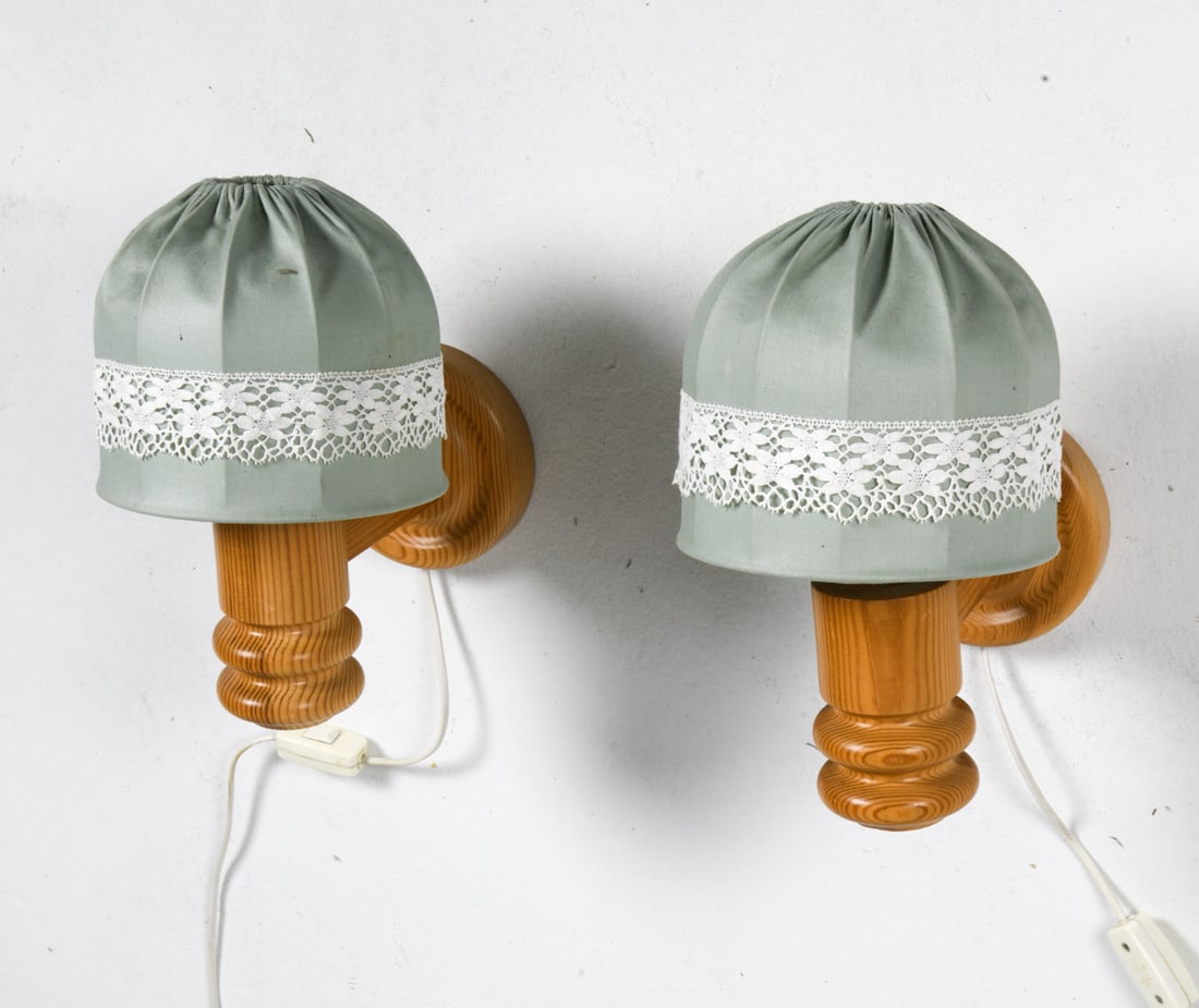 PAIR SOLBACKENS SVARVERI SWEDISH SCONCES: Pine wall sconces/lamps featuring green fabric shades. Marked underneath. Dimensions: H 10" x W 10" Condition: Untested, European plug. Light soiling to shades. A44