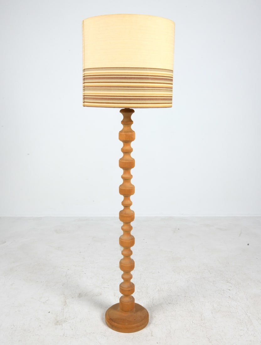 SCANDINAVIAN BEECH FLOOR LAMP C. 1970S: Turned beech floor lamp. Scandinavian, circa 1970s. Dimensions: H 55" x Dia. 15". Condition: Wiring untested, European plug. Minor scuffs and dings. Wear consistent with age and use.