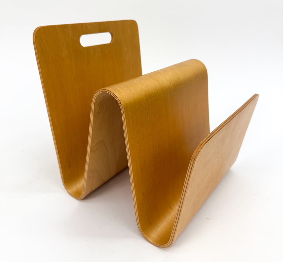 ERIC PFEIFFER BENTWOOD "W" MAGAZINE RACK: For OFFI & Company. Bent maple plywood frame. Apparently unmarked. 21th century. Dimensions: H 14" x W 13" x D 12" Condition: Minor scuffs and scratches. Wear consistent with age and use.
