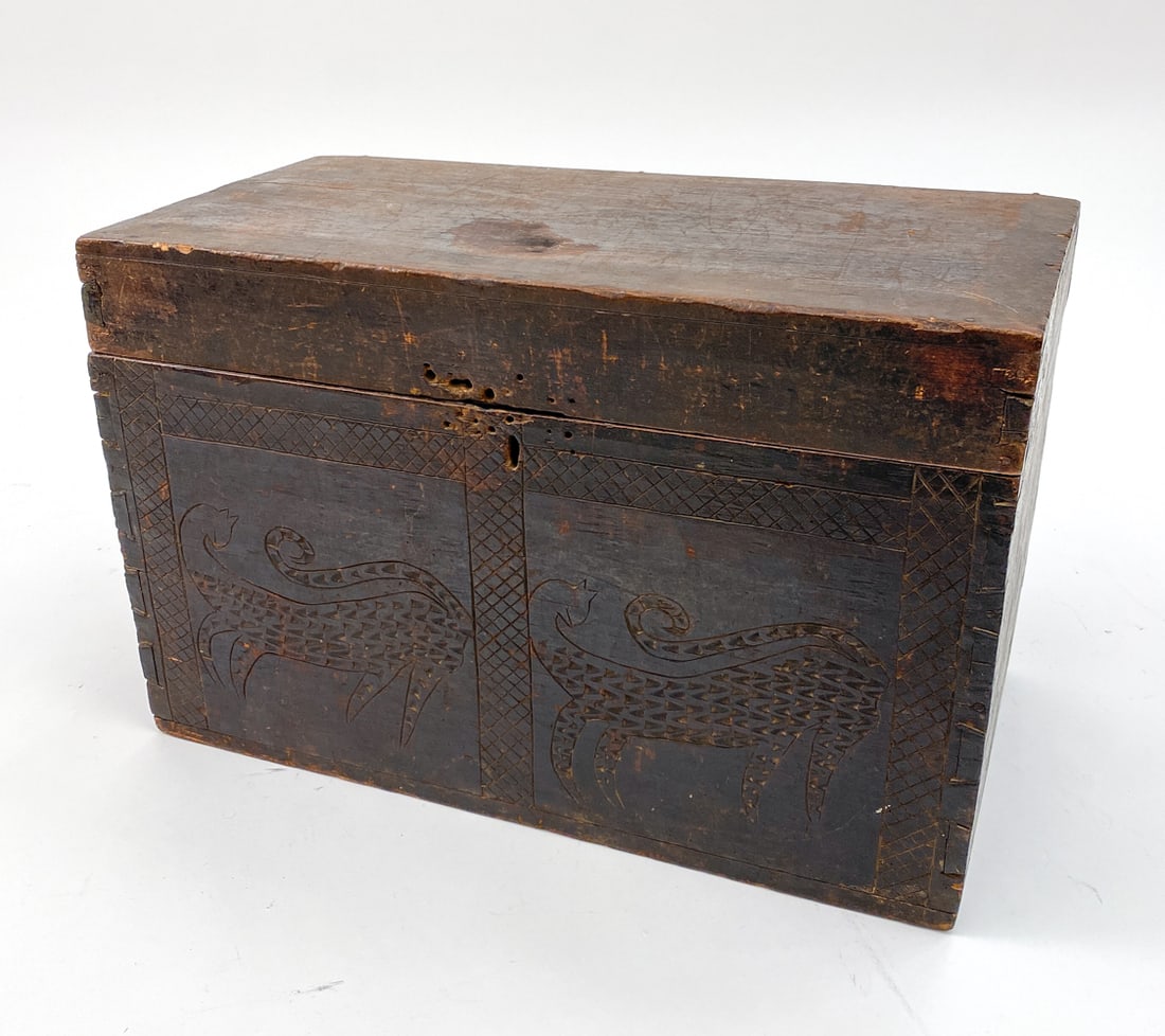 19TH C. AFRICAN CHIP CARVED CHEST: African tribal chip carved chest or trunk with textured cat motif at the front with crossed diamond patterns. Dimensions: H 15.75" x W 24.75" x D 12.5" Condition: Lacking locking mechanism. Wear consi