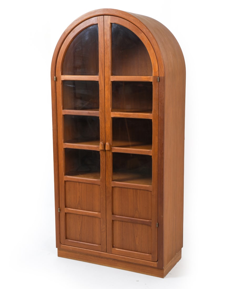 DYRLUND DANISH TEAK & GLASS CABINET CIRCA 1970'S: Danish teak display cabinet, featuring two large arched glass doors with shelves inside. Apparently unmarked. Denmark, circa 1970's. Dimensions: H 74" x W 35.5" x D 17.75" Condition: Loss to edges on