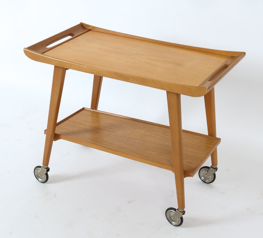 MID-CENTURY GERMAN BEECH BAR CART CIRCA 1960'S: German beech bar cart with casters and a bottom tray. Germany, circa 1960's. Dimensions: H 23.5" x W 29" x D 15.5" Condition: Couple of minor scratches to edges, few scuffs, light soiling to underside