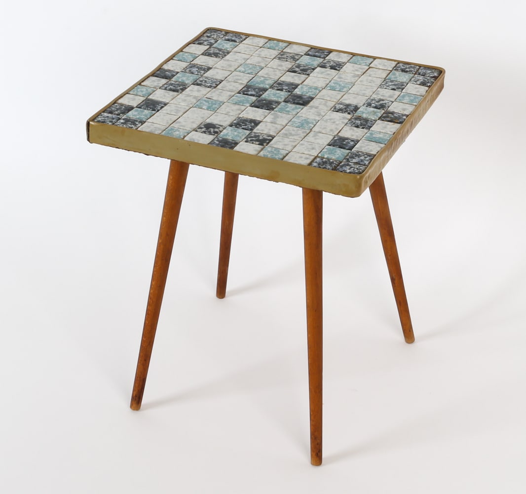 MID-CENTURY DANISH MOSAIC TILE SIDE TABLE: Ceramic tile flower table featuring mosaic design and teak legs. Denmark, circa 1960's. Dimensions: H 14" x W 11.25" x D 11.25" Condition: Light warping to corners. Minor soiling spots to tile and und