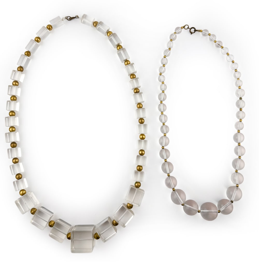 1970S LUCITE ICE CUBE & ACRYLIC BEAD NECKLACES: Grouping of two necklaces including one with lucite ice cube design and other with acrylic round beads, both with gold-tone spacer beads. Both unmarked. Dimensions: (Larger) L 14.25" Condition: Tarnis