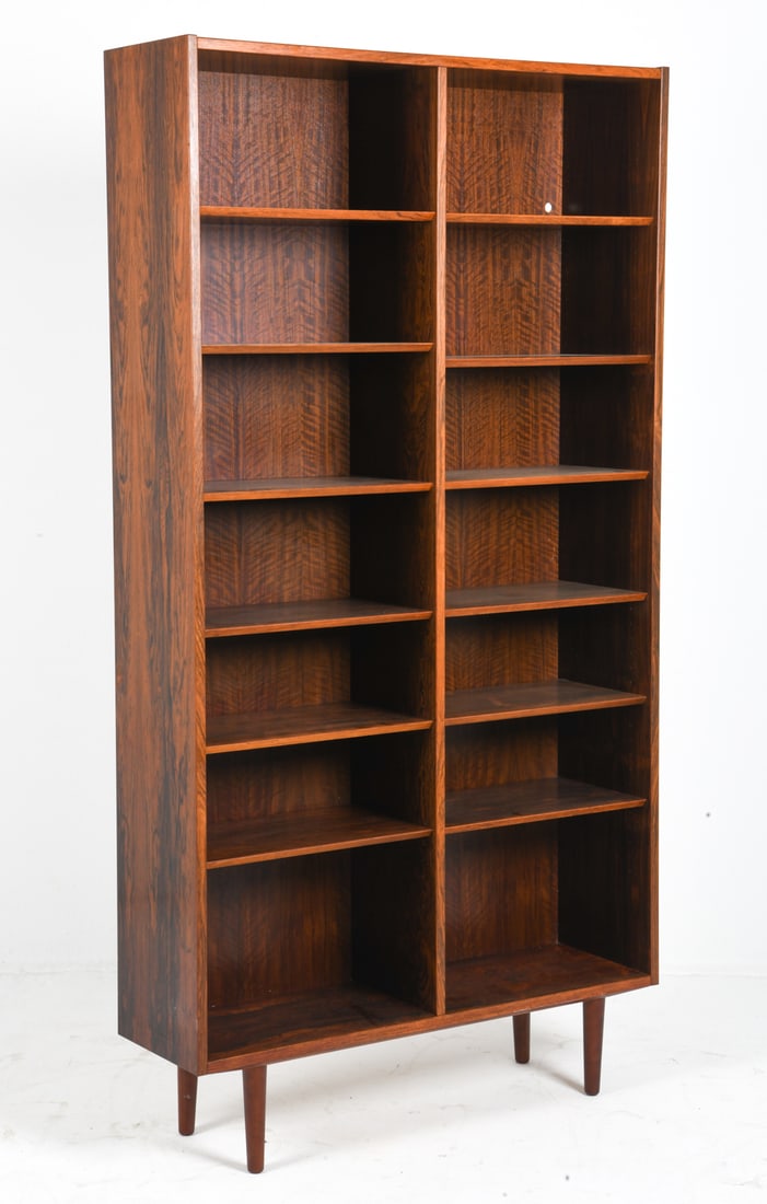 POUL HUNDEVAD DANISH ROSEWOOD BOOKCASE C. 1960S: Stamped on back. Adjustable shelves. Denmark, circa 1960s. Dimensions: H 80.5" x W 42.5" x D 12.25". Condition: Hole cut out into back. Wear consistent with age and use. DMT080