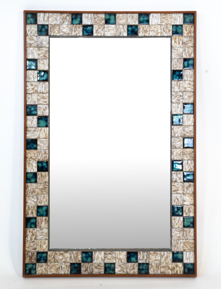 DANISH TEAK & CERAMIC TILE WALL MIRROR C. 1970S: Teak with ceramic tiles inlaid to frame. Denmark, circa 1970s. Dimensions: H 23.5" x W 15.5". Condition: Wear consistent with age and use, presents well overall. DMW215