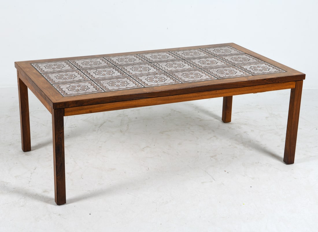 DANISH ROSEWOOD & CERAMIC TILE COFFEE TABLE: Rosewood coffee table with ceramic tiles inlaid to top. Denmark, circa 1960s. Dimensions: H 20" x W 53" x D 29". Condition: Minor scuffs to wood, presents well overall. DMW088