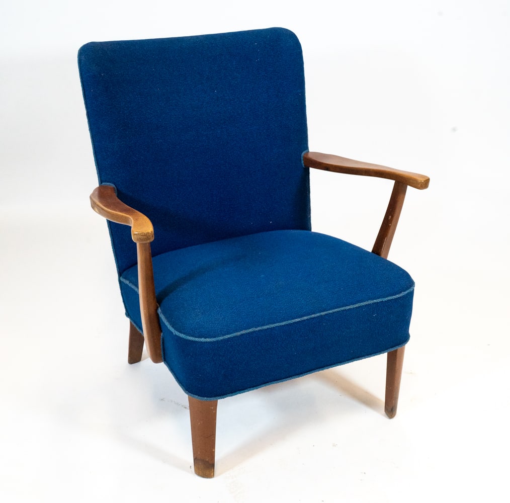 DANISH BEECH LOUNGE CHAIR C. 1960S: Lounge chair with beech arms and legs with blue wool fabric upholstery. Denmark, circa 1960s. Dimensions: H 32.25" x W 25.5" x D 22" x SH 15". Condition: Scuffs and scratches to legs and arms. Wear co