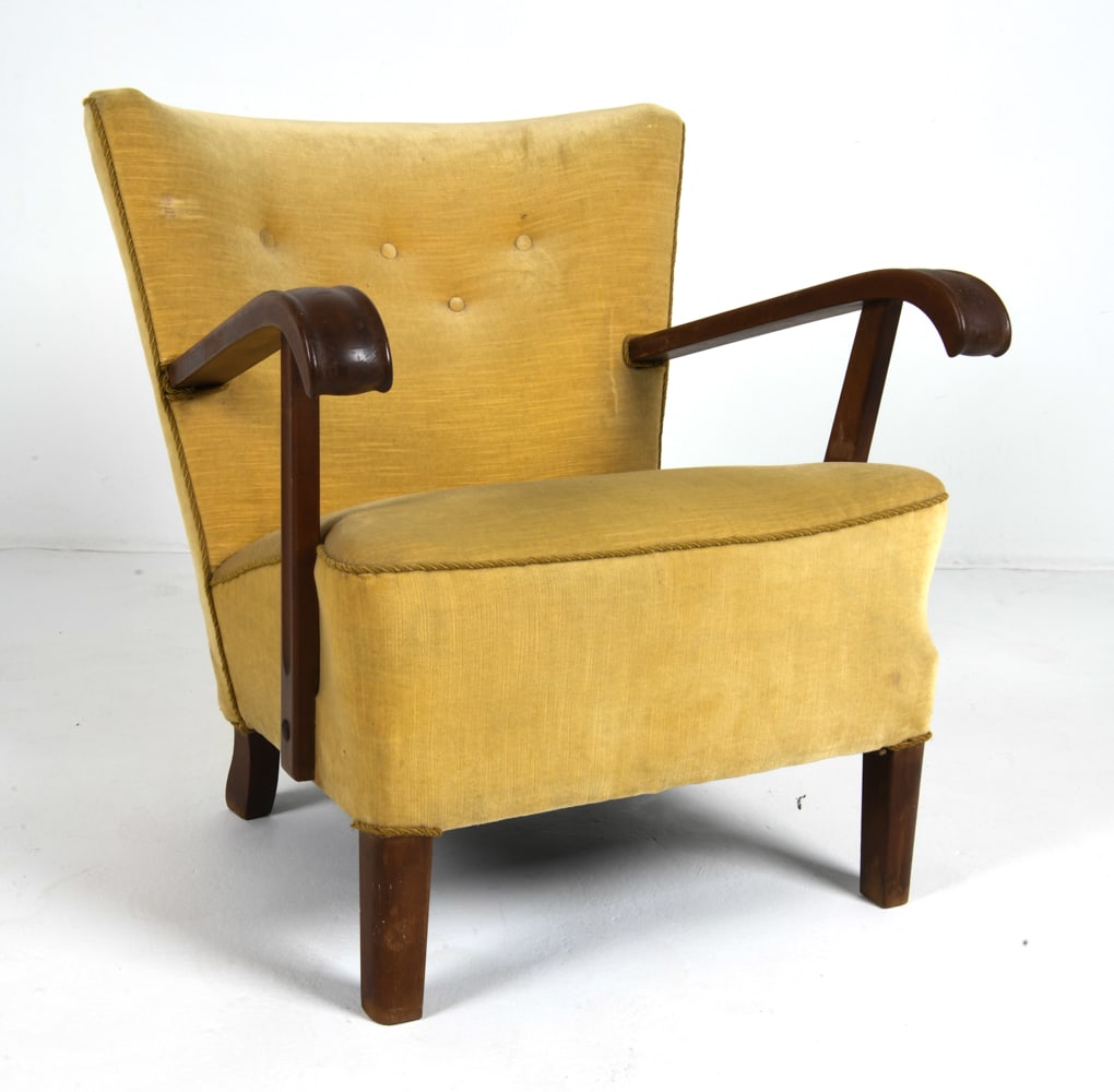 DANISH TEAK & MOHAIR LOUNGE CHAIR C. 1950S: Carved teak frame with yellow mohair upholstery. Denmark, circa 1960s. Dimensions: H 30.25" x W 28.5" x D 29" x SH 16.5". Condition: Few scuffs and faint water spots to arms. Rubs to mohair and fading
