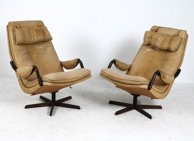 PAIR OF ATTR. BERG FURNITURE LEATHER SWIVEL CHAIRS