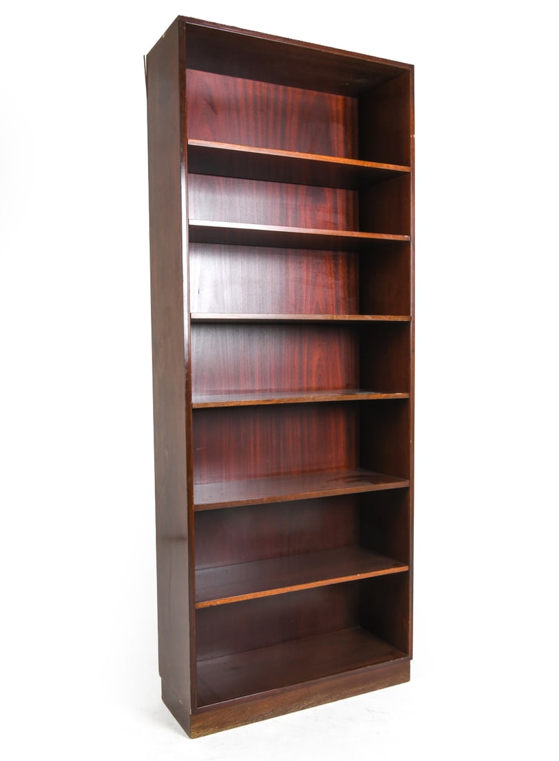 ATTR. POUL HUNDEVAD DANISH ROSEWOOD BOOKCASE 1960S: Adjustable shelves. Denmark, circa 1960s. Dimensions: H 81.5" x W 31.5" x D 12.25". Condition: Peeling to veneer on upper edge. Few scuffs and scratches. Wear consistent with age and use. DMW176