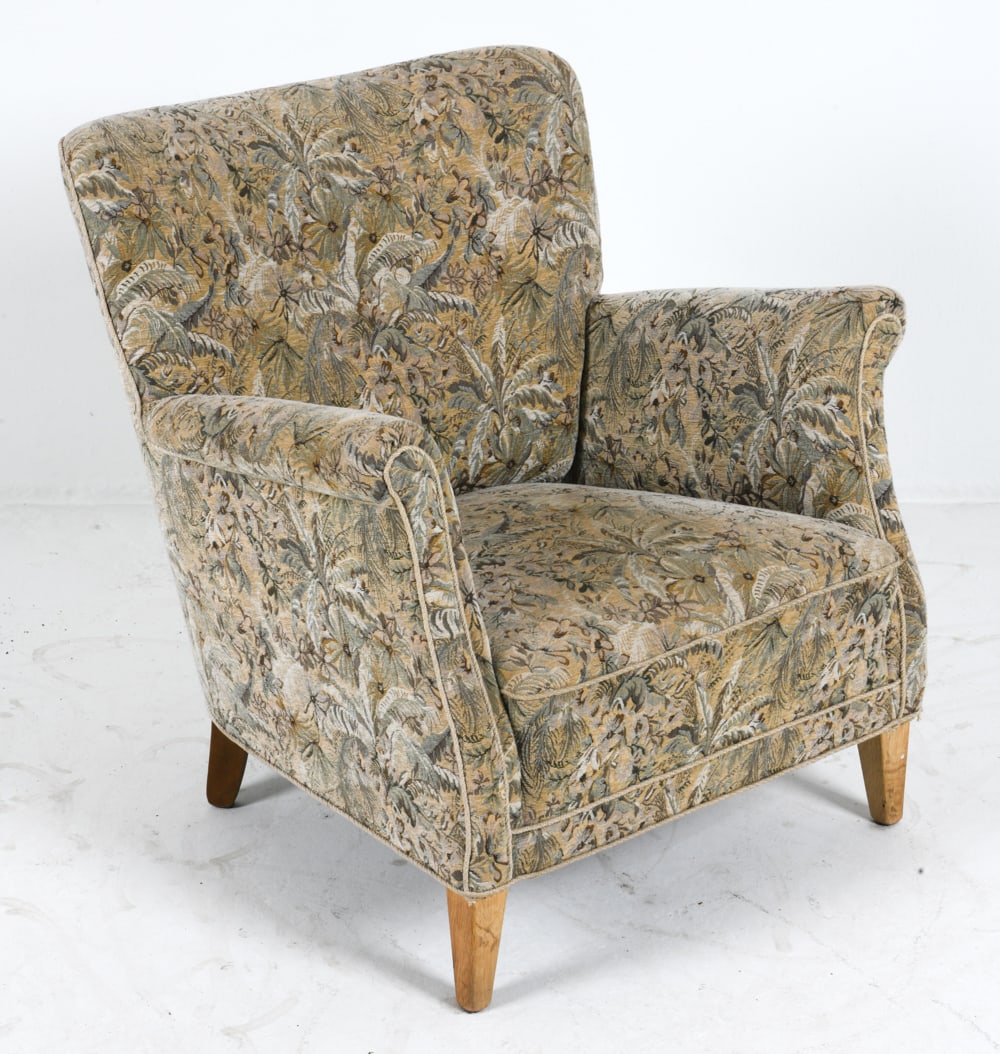 SCANDINAVIAN OAK & FLORAL LOUNGE CHAIR C. 1960S: Lounge chair with floral fabric upholstery and oak feet. Scandinavian, circa 1960s. Dimensions: H 30.5" x W 27.5" x D 26.5" x SH 14.25". Condition: Scuffs and dings to feet. Wear consistent with age a