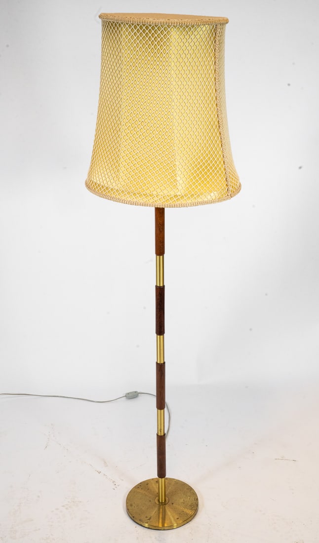 DANISH TEAK & BRASS FLOOR LAMP C. 1960S: Floor lamp with teak & brass segments to stand. Woven webbing stretched over shade. Denmark, circa 1960s. Dimensions: H 60" x Dia. 17". Condition: Few scuffs and scratches, slight oxidation to base. W