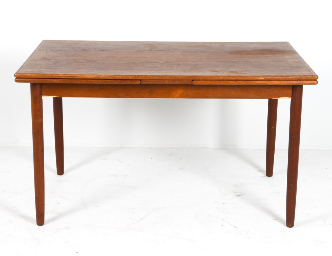 STYLE OF MOLLER DANISH TEAK EXPANDING DINING TABLE: (2) Leaves included. Denmark, circa 1960s. Dimensions: H 28.75" x W 51.25" x D 33.5" (Leaf W 21.25"). Conditions: Wear consistent with age and use, including minor dings and scratches. Chip to veneer