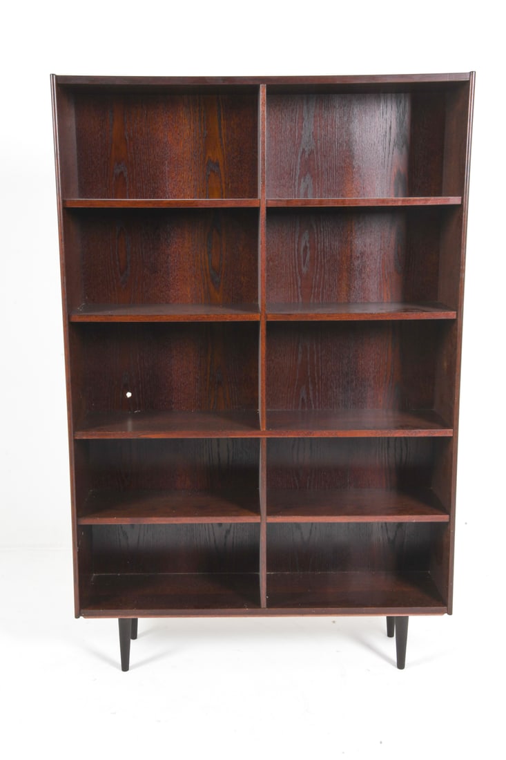 ATTR. OMANN JUN DANISH OAK BOOKCASE C. 1960S: Adjustable shelves. Denmark, circa 1960s. Dimensions: H 76" x W 49.5" x D 12". Conditions: Wear consistent with age and use, including minor rubs and scuffs. DMU202